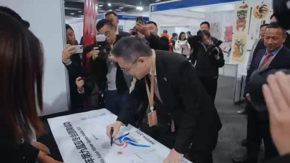 Exhibitor display and visitors at the New Zealand–China Products Expo